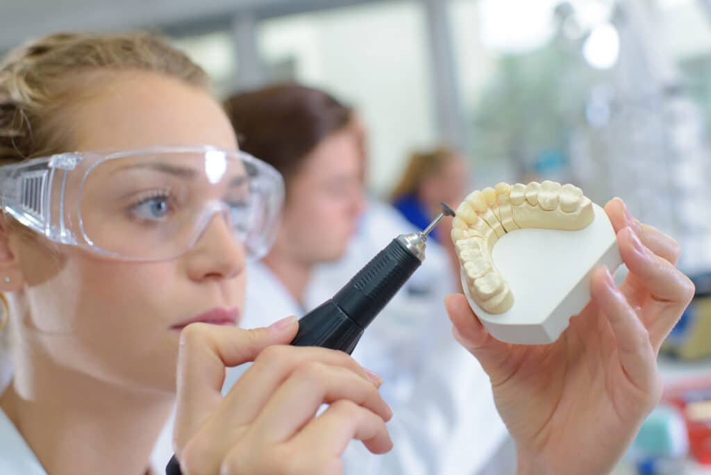 Closeup Of Dental Technician Working - Australian Dental Technicians Association